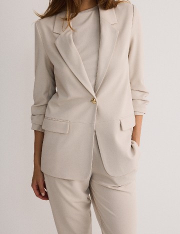 
						Sacou Reserved, crem